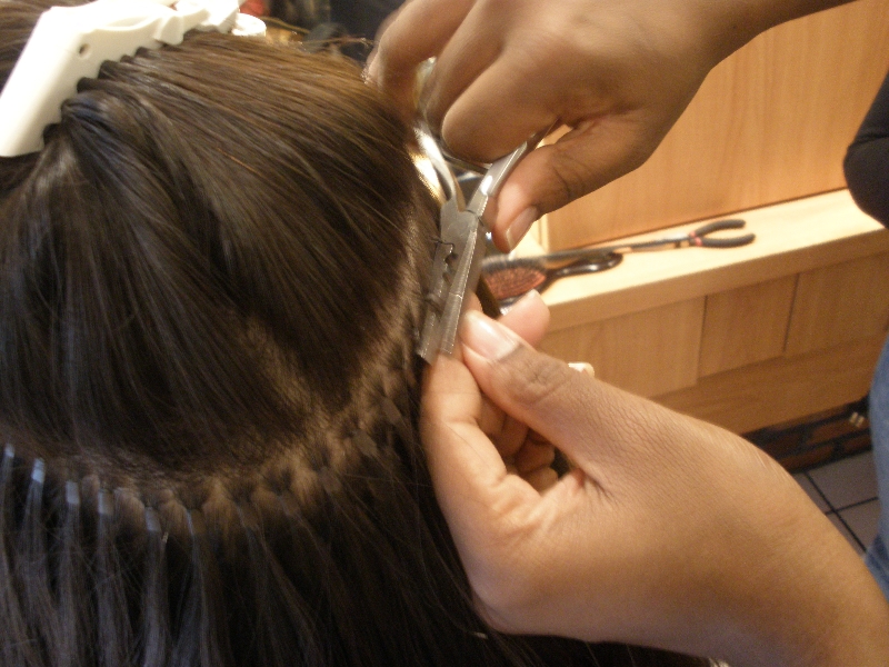 Hair extensions being added